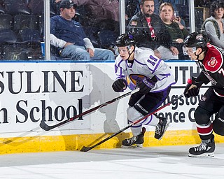 Scott R. Galvin | The Vindicator.Youngstown Phantoms forward Ben Schoen (19) skates past Chicago Steel defenseman Matteo Pietroniro (7) for the puck during the second period at the Covelli Centre on Saturday, Dec. 15, 2018.
