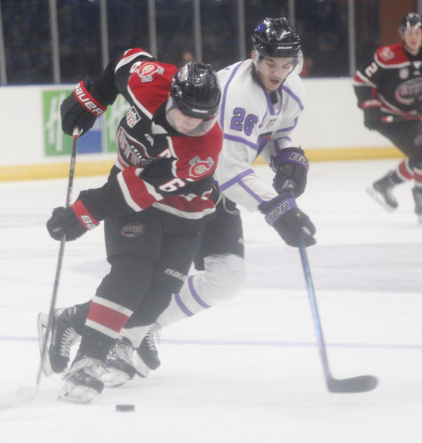The Phantoms' Josh DeLuca tries to get the puck away from Chicago Steel's Nick Abruzzese during their game at Covelli Centre on Sunday night. EMILY MATTHEWS | THE VINDICATOR