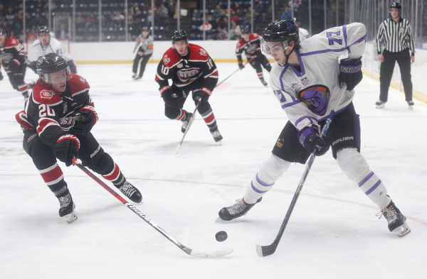 Chicago Steel's Uula Ruikka gets the puck away from Phantoms' Matthew Barnaby Jr. during their game at Covelli Centre on Sunday night. EMILY MATTHEWS | THE VINDICATOR