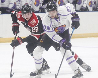 Chicago Steel's Owen Power tries to get the puck away from Phantoms' Josh DeLuca during their game at Covelli Centre on Sunday night. EMILY MATTHEWS | THE VINDICATOR