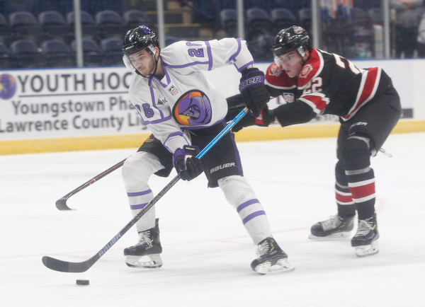 Chicago Steel's Owen Power tries to get the puck away from Phantoms' Josh DeLuca during their game at Covelli Centre on Sunday night. EMILY MATTHEWS | THE VINDICATOR