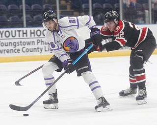 Chicago Steel's Owen Power tries to get the puck away from Phantoms' Josh DeLuca during their game at Covelli Centre on Sunday night. EMILY MATTHEWS | THE VINDICATOR