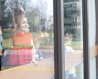 Abby Mannion, 4, of Campbell, waves as Santa arrives during Campbell's annual Lunch with Santa at St. Lucy Palermo Hall on Sunday afternoon. EMILY MATTHEWS | THE VINDICATOR