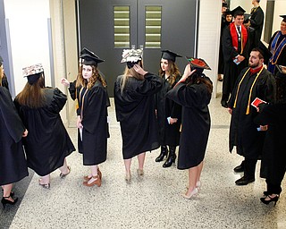 YSU students line up to graduate in Beeghly Center on Sunday afternoon. EMILY MATTHEWS | THE VINDICATOR