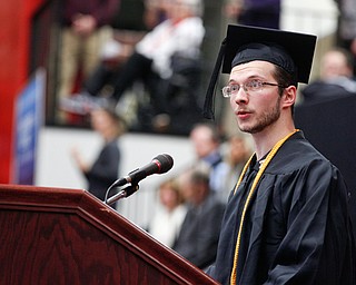 Commencement student speaker Alexander Bonnette, who received his Bachelors in Engineering, speaks during YSU's commencement ceremony in Beeghly Center on Sunday afternoon. EMILY MATTHEWS | THE VINDICATOR