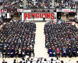 YSU graduates wait to receive their diplomas during YSU's commencement ceremony in Beeghly Center on Sunday afternoon. EMILY MATTHEWS | THE VINDICATOR