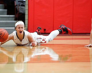 Struthers' Emma Elia reacts after falling from trying to keep the ball from South Range's Bree Kohler during their game at Struthers on Monday night. EMILY MATTHEWS | THE VINDICATOR