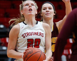 Struthers' Renee Leonard looks toward the hoop while South Range's Hannah Heikkinen runs up behind her during their game at Struthers on Monday night. EMILY MATTHEWS | THE VINDICATOR