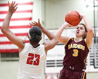 South Range's Izzy Lamparty shoots towards the hoop while Struthers' Trinity McDowell tries to block her during their game at Struthers on Monday night. EMILY MATTHEWS | THE VINDICATOR