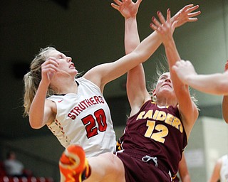 Struthers' Renee Leonard and South Range's Bree Kohler reach for a rebound during their game at Struthers on Monday night. EMILY MATTHEWS | THE VINDICATOR