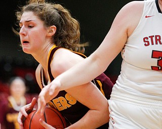 South Range's Izzy Lamparty grabs the ball while Struthers' Trinity Farrar tries to block her during their game at Struthers on Monday night. EMILY MATTHEWS | THE VINDICATOR