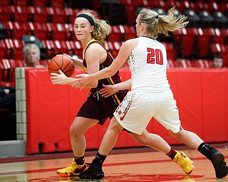 South Range's Bree Kohler dribbles the ball while Struthers' Renee Leonard tries to block her during their game at Struthers on Monday night. EMILY MATTHEWS | THE VINDICATOR