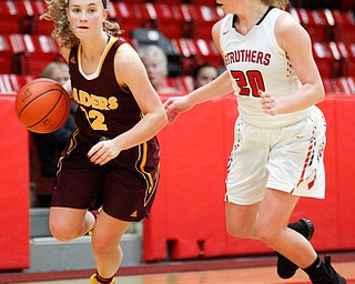 South Range's Bree Kohler dribbles the ball while Struthers' Renee Leonard tries to block her during their game at Struthers on Monday night. EMILY MATTHEWS | THE VINDICATOR