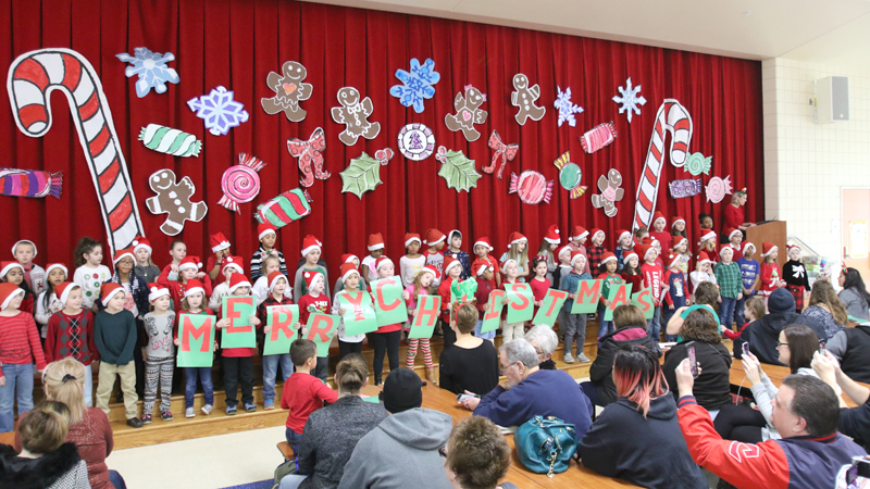 Austintown Elementary first-grade students put on a Christmas concert Monday with carols, signs and dancing.