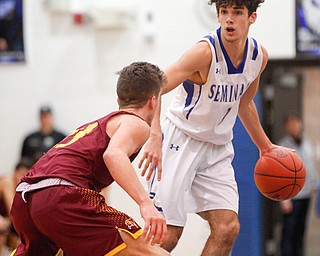 Poland's Andrew Centofanti looks to pass the ball while South Range's Jaxon Anderson tries to block him during their game at Poland on Tuesday night. EMILY MATTHEWS | THE VINDICATOR