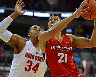 COLUMBUS, OHIO - DECEMBER 18, 2018: Youngstown State's Noe Anabir goes to the basket against Ohio State's Kaleb Wesson during the second half of their game, Tuesday night at the Schottenstein Center. Ohio State won 75-56. DAVID DERMER | THE VINDICATOR