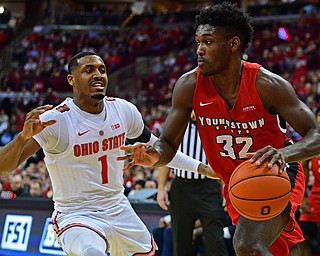 COLUMBUS, OHIO - DECEMBER 18, 2018: Youngstown State's Garrett Covington drives on Ohio State's Luther Muhammad during the second half of their game, Tuesday night at the Schottenstein Center. Ohio State won 75-56. DAVID DERMER | THE VINDICATOR