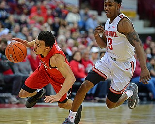 COLUMBUS, OHIO - DECEMBER 18, 2018: Youngstown State's Darius Quisenberry falls to the ground after being fouled by Ohio State's C.J. Jackson during the second half of their game, Tuesday night at the Schottenstein Center. Ohio State won 75-56. DAVID DERMER | THE VINDICATOR