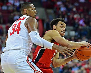 COLUMBUS, OHIO - DECEMBER 18, 2018: Youngstown State's Darius Quisenberry looks to pass the ball while being pressured by Kaleb Wesson during the second half of their game, Tuesday night at the Schottenstein Center. Ohio State won 75-56. DAVID DERMER | THE VINDICATOR