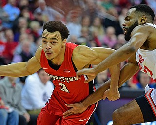 COLUMBUS, OHIO - DECEMBER 18, 2018: Youngstown State's Darius Quisenberry drives on Ohio State's Keyshawn Woods during the second half of their game, Tuesday night at the Schottenstein Center. Ohio State won 75-56. DAVID DERMER | THE VINDICATOR