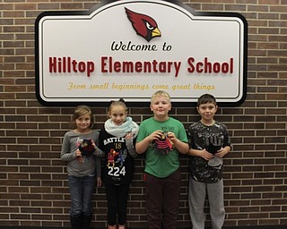 Neighbors | Abby Slanker.Hilltop Elementary School third-grade students displayed just a few pairs of the winter gloves the school collected to be donated to The Dorothy Day House as part of a service project on Nov. 15.