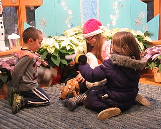 Neighbors | Jessica Harker .Children played at the Fellows Riverside Garden's library during the park's annual Winter Celebration throughout the month of December.