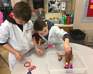 Neighbors | Submitted.Michael Flores and Ben Furtaw created a plan to try to get gingerbread to cross the river without getting wet during one of the STEM Friday events.