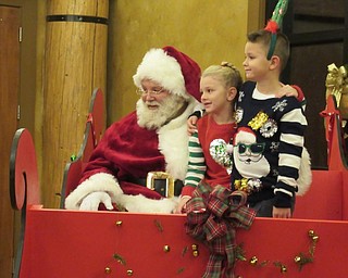 Neighbors | Jessica Harker.Allie Rotunno and Dominic Woodward posed with Santa Claus on Dec. 6 at the Boardman Park.