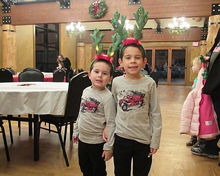 Neighbors | Jessica Harker.Joshua and Caleb Beveridge wore light up antlers provided by Armstrong for Boardman Park's annual Supper with Santa on Dec. 6.