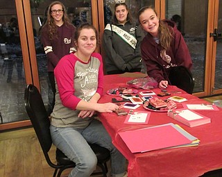 Neighbors | Jessica Harker.Emily Maroni and Jessica Winsen, volunteers from Boardman High School, helped at crafting tables at the park's annual Supper with Santa event.