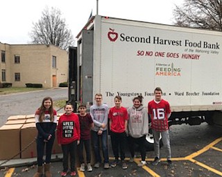 Neighbors | Abby Slanker.Canfield Village Middle School student council members helped load donations of non-perishable food items onto the Second Harvest Food Bank truck on Dec. 3. The donations were collected during student council’s annual food drive to benefit Second Harvest Food Bank.