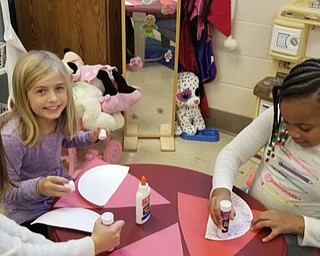 Neighbors | Submitted .Poland Union students worked independently to create Santa's from paper plates and construction paper to give to local nursing homes for the holidays.