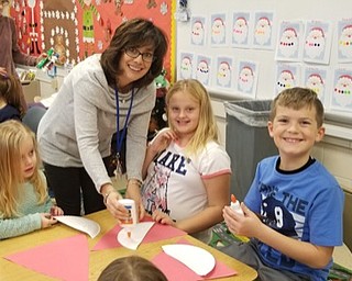Neighbors | Submitted .Second grade teacher Phyllis Jeswald helped students as they created crafts for local nursing homes.