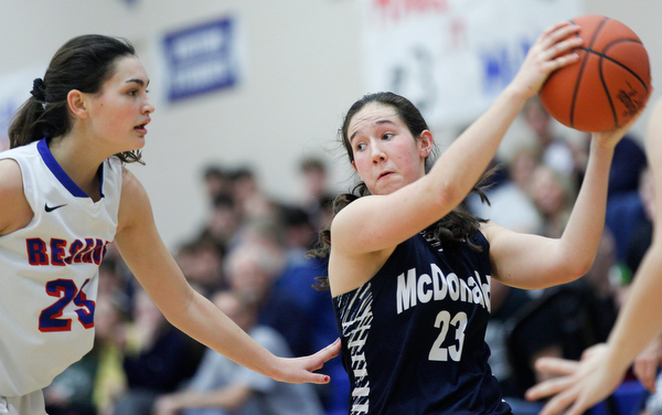 McDonald's Sophia Costantino pulls the ball away from Western Reserve's Erica DeZee during their game at Western Reserve on Thursday night. EMILY MATTHEWS | THE VINDICATOR