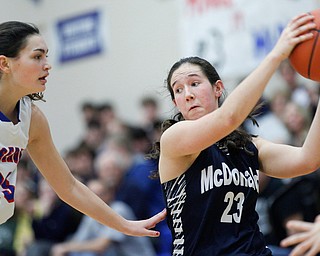 McDonald's Sophia Costantino pulls the ball away from Western Reserve's Erica DeZee during their game at Western Reserve on Thursday night. EMILY MATTHEWS | THE VINDICATOR