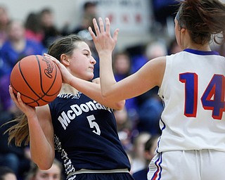 McDonald's Lucy Wolford looks to pass the ball while Western Reserve's Kennedy Miller tries to block her during their game at Western Reserve on Thursday night. EMILY MATTHEWS | THE VINDICATOR