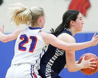 McDonald's Sophia Costantino looks to pass the ball while Western Reserve's Olivia Pater tries to block her during their game at Western Reserve on Thursday night. EMILY MATTHEWS | THE VINDICATOR