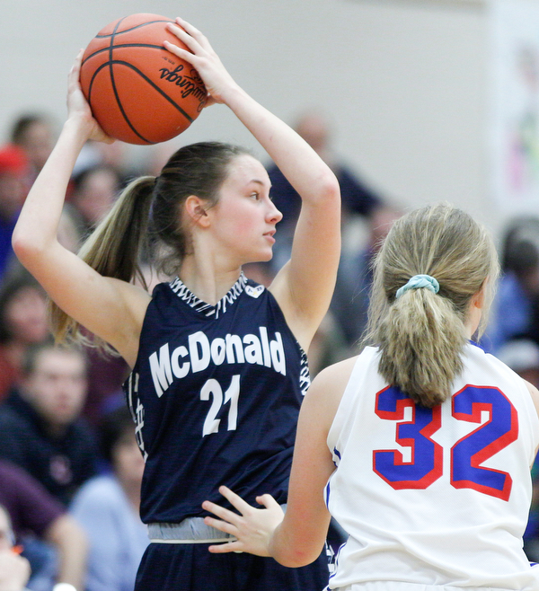 McDonald's Maddy Howard looks to pass the ball while Western Reserve's Alyssa Serensky tries to block her during their game at Western Reserve on Thursday night. EMILY MATTHEWS | THE VINDICATOR