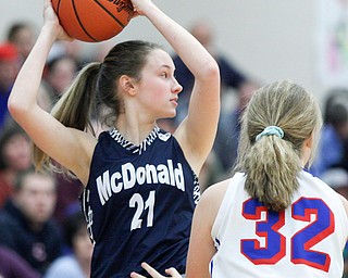 McDonald's Maddy Howard looks to pass the ball while Western Reserve's Alyssa Serensky tries to block her during their game at Western Reserve on Thursday night. EMILY MATTHEWS | THE VINDICATOR