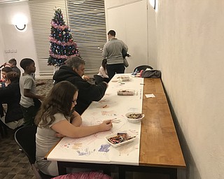 Neighbors | Jessica Harker.Community members colored, played games and enjoyed snacks provided by the library Dec. 10 during Austintown's first Reindeer Games event.