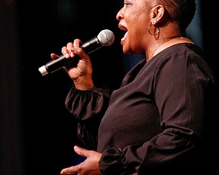 Janice Jones, of Youngstown, sings during the All-City Variety Show Benefit Concert at East High School on Friday night. EMILY MATTHEWS | THE VINDICATOR