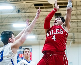 DIANNA OATRIDGE | THE VINDICATOR Niles' Cyler Kane-Johnson (4) shoots over Lakeview's Carter Huff (left) during the Bulldogs' 68-41 victory in Cortland on Friday.