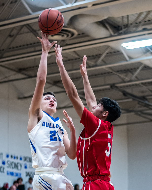 DIANNA OATRIDGE | THE VINDICATOR Lakeview's Jeff Remmick (21) puts up a shot over  Niles' Vincent Chieffo (5) during their 68-41 victory in Cortland on Friday.