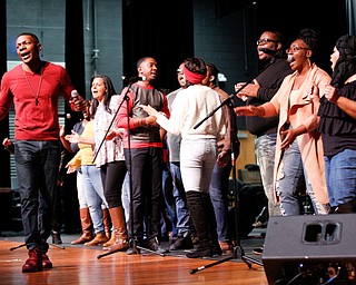 Jay Simon, left, one of the organizers of the All-City Variety Show Benefit Concert, sings with the Youngstown Community Fellowship Choir at the benefit concert at East High School on Friday night. EMILY MATTHEWS | THE VINDICATOR