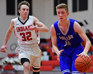 GIRARD, OHIO - DECEMBER 21, 2018: Poland's Jacob Hryb goes to the basket after getting behind Girard's Dom Malito during the second half of their game, Friday night at Girard High School. DAVID DERMER | THE VINDICATOR