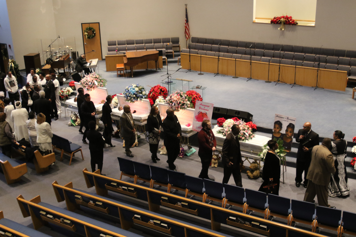      ROBERT  K. YOSAY | THE VINDICATOR.. Services for the five children killed Dec. 9 in a fire at their Parkcliffe Avenue home were held at New Bethel Baptist Church...Clergy and pastors file past the caskets of the five children