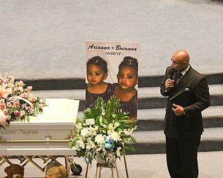      ROBERT  K. YOSAY | THE VINDICATOR.. Services for the five children killed Dec. 9 in a fire at their Parkcliffe Avenue home were held at New Bethel Baptist Church...Rev Ken Simon Pastor New Bethel Baptist church opens the funeral service