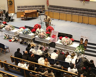      ROBERT  K. YOSAY | THE VINDICATOR.. Services for the five children killed Dec. 9 in a fire at their Parkcliffe Avenue home were held at New Bethel Baptist Church...Rev Louis Macklin  officiated over the first part of the service