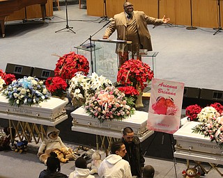      ROBERT  K. YOSAY | THE VINDICATOR.. Services for the five children killed Dec. 9 in a fire at their Parkcliffe Avenue home were held at New Bethel Baptist Church...Rev Louis Macklin  officiated over the first part of the service