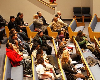      ROBERT  K. YOSAY | THE VINDICATOR.. Services for the five children killed Dec. 9 in a fire at their Parkcliffe Avenue home were held at New Bethel Baptist Church...People sat quietly as the funeral service was underway